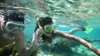 Couple snorkeling in Caribbean waters